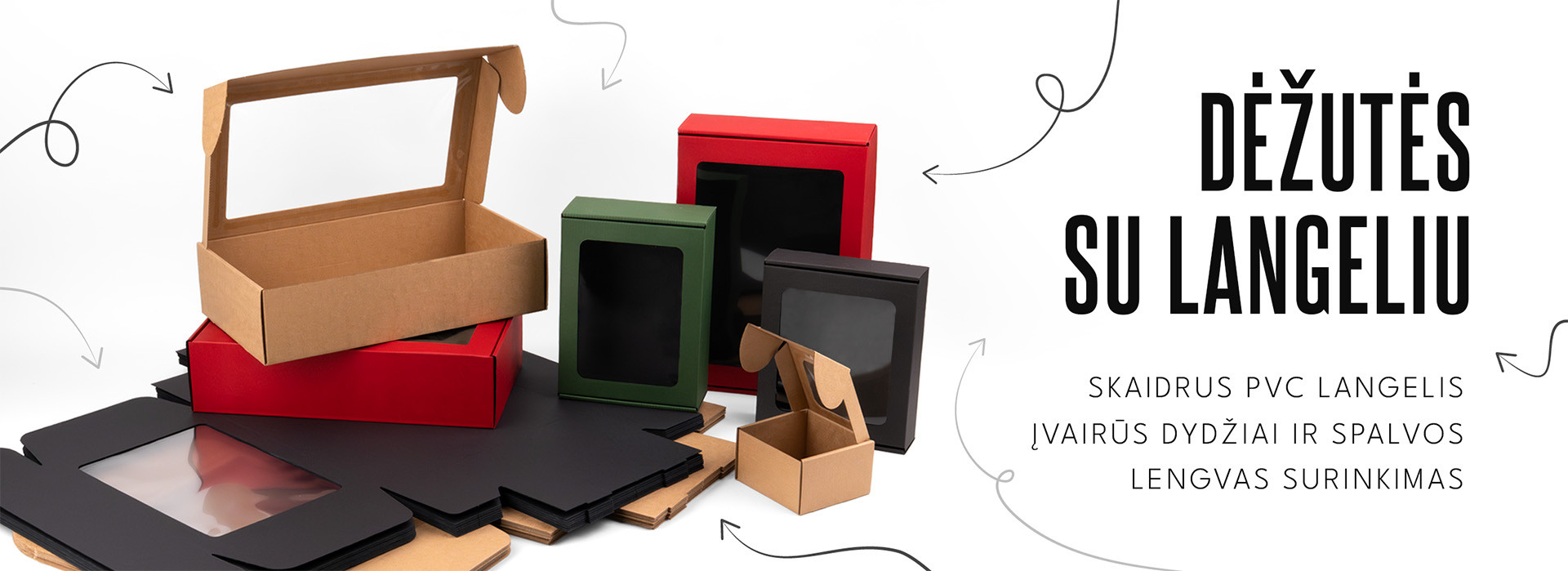 Įvairių dydžių ir spalvų gofruoto kartono dėžutės su skaidriais PVC langeliais baltame fone.